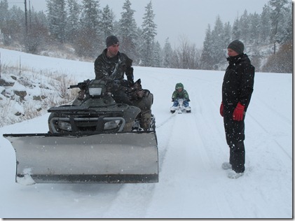 RBuchanan photo Neigbour Dave pauses with Mark from giving son Jordan a sleigh ride